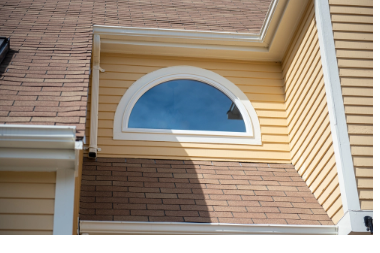 Arched shaped window on a home exterior